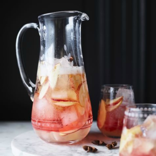 Apple cider cocktail in clear glass pitcher - Williams Sonoma. #applecocktail #cocktails #applecider