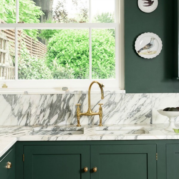 Bespoke English country kitchen by deVOL with a custom green paint color on cabinets and walls. #kitchendesign #englishkitchen #greenkitchen #deVOL