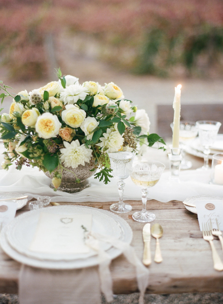 Lovely romantic wedding tablescape and place setting at a winery wedding - Flora and Spice.