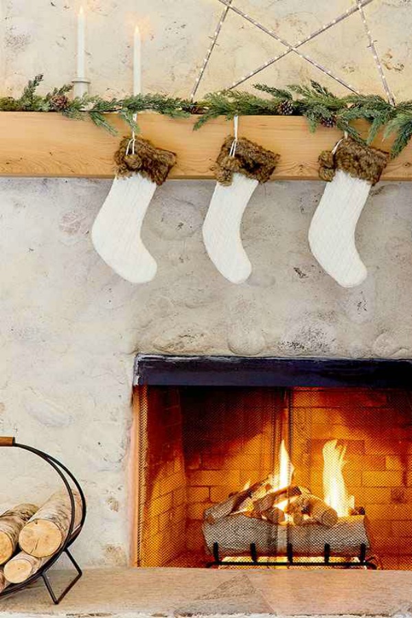 Cozy white Christmas decor and rustic fireplace - Emily Henderson for Target. #rusticdecor #holidaydecorating #fireplace 