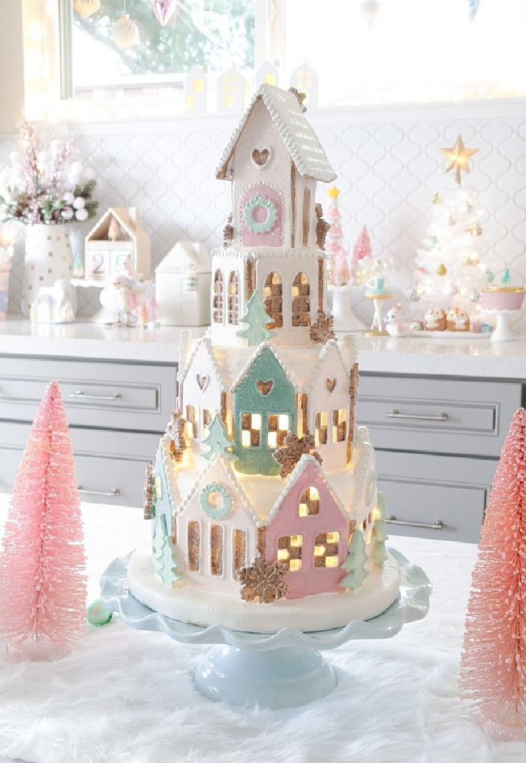 Enchanting pastel Christmas gingerbread cookie village tower on a pedestal in a lovely kitchen @freshlyfuji.