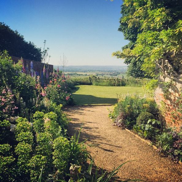 English country cottage exterior and gardens at the Hatch near London (Beach Studios). #cottageexterior #cottagegarden