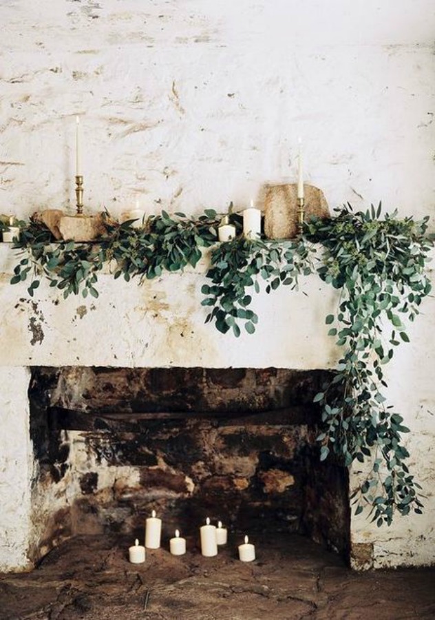 Romantic and rustic fireplace with greenery and candles - Happywedd. #fireplacedecor #romanticdecor