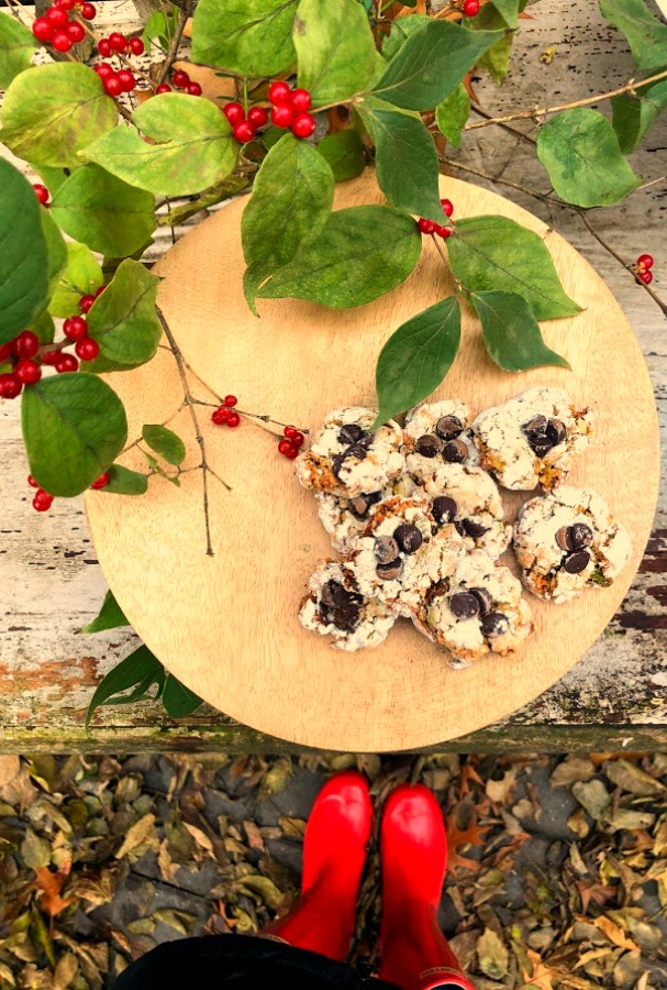 Pistachio Almond Crinkle Cookies on a Wood Pedestal - Hello Lovely Studio. #hellolovelystudio #cookierecipe #pistachio