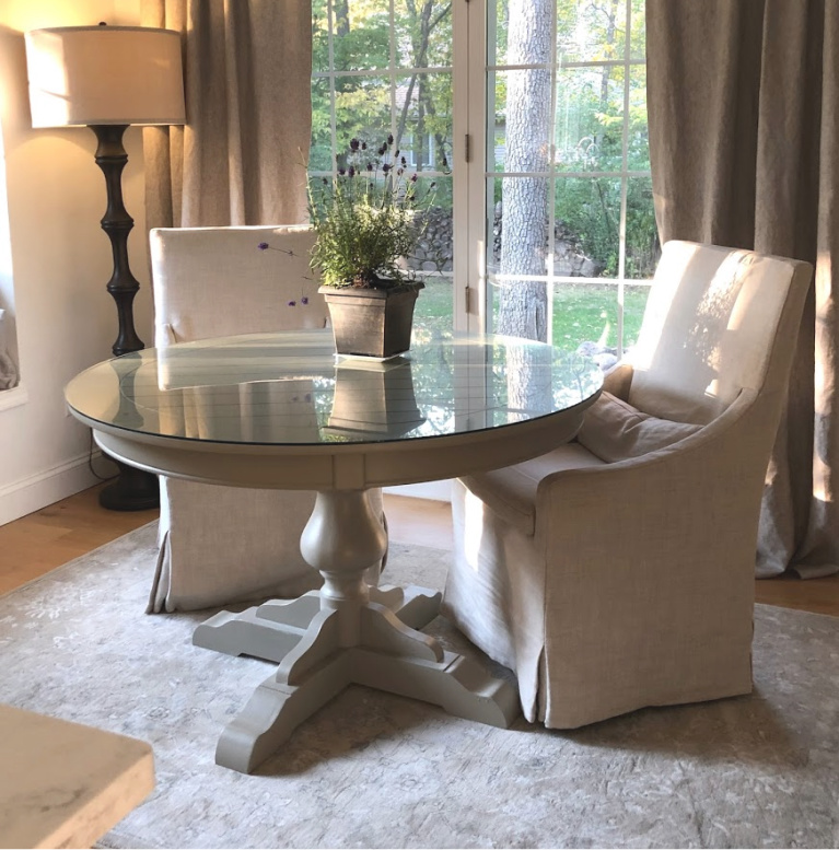 Serene breakfast dining with round table and slope arm chairs from RH in Belgian linen (Sand) - Hello Lovely Studio.