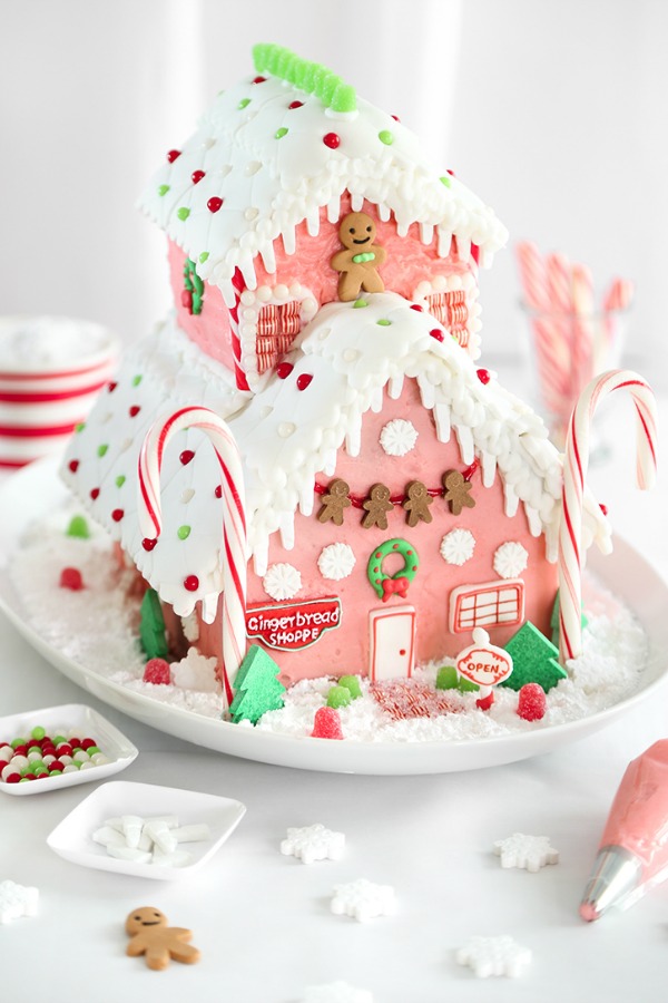 Magnificent pink gingerbread shop gingerbread house by Sprinkle Bakes! #gingerbreadhouse #candyhouse #pinkChristmas #holidaybaking