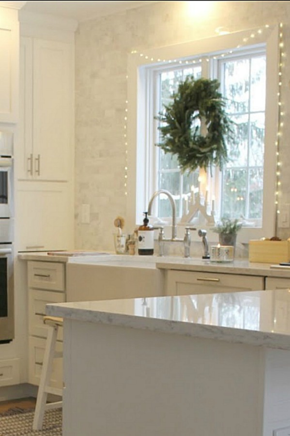 White Christmas decorated kitchen in my home - Hello Lovely Studio. #hellolovelystudio #christmaskitchen #christmasdecor