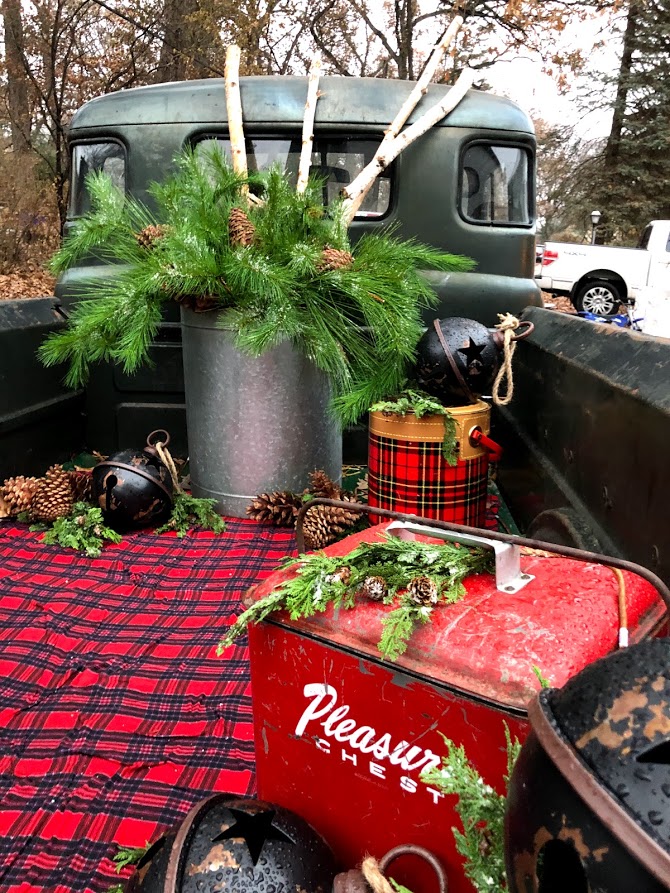 Christmas plaid farmhouse Christmas decor in a vintage truck at Urban Farmgirl - November 2019.