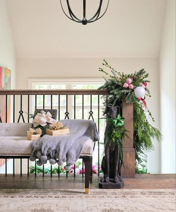 Christmas fresh greenery on staircase in the elegant Atlanta Home for the Holidays Showhouse - design by Davenport Designs; decor by Boxwoods Atlanta.