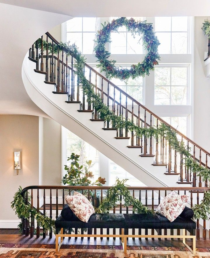 Magnificent architecture and staircase in the Atlanta Home for the Holidays Showhouse with architecture by Harrison Design and Design by Chris Holt. Photo by DHCPhoto