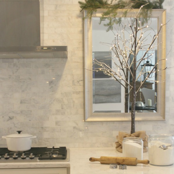 White Christmas decor in my classic white kitchen - Hello Lovely Studio. #hellolovelystudio #christmasdecor #whitechristmasdecor