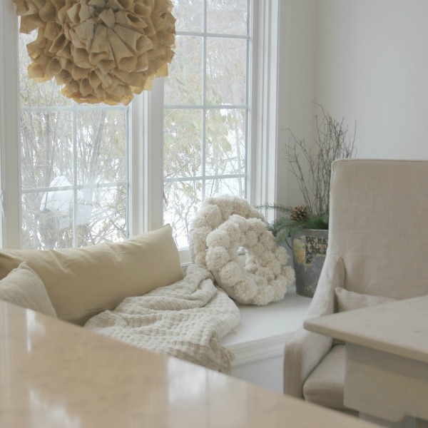 White Christmas decor in my classic white kitchen - Hello Lovely Studio. #hellolovelystudio #christmasdecor #whitechristmasdecor