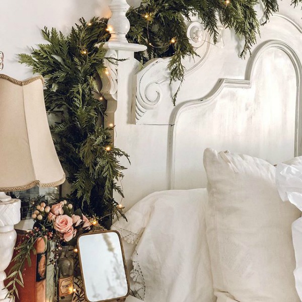 White Christmas decorated French country bedroom by Le Cultivateur.  23 Charming Christmas Decorating Ideas to Save. #christmasdecor #frenchchristmas #christmasbedroom #holidaydecor