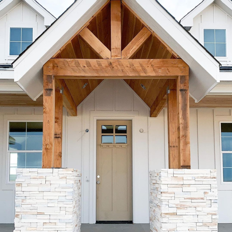 Charming entrance to a board and batten farmhouse by @jessenfarmhouse painted Sherwin Williams Shoji White. #shojiwhite #sherwinwilliams #whitepaintcolors #whitehouseexteriors