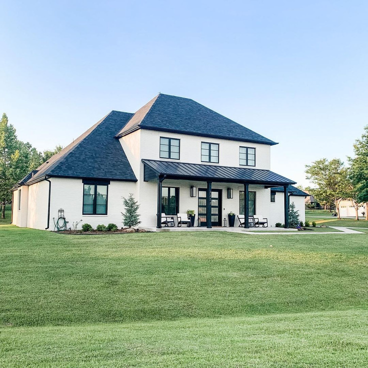 Shoji White (Sherwin Williams) paint on a modern farmhouse exterior - @houseofrad405. #houseexteriors #shojiwhite