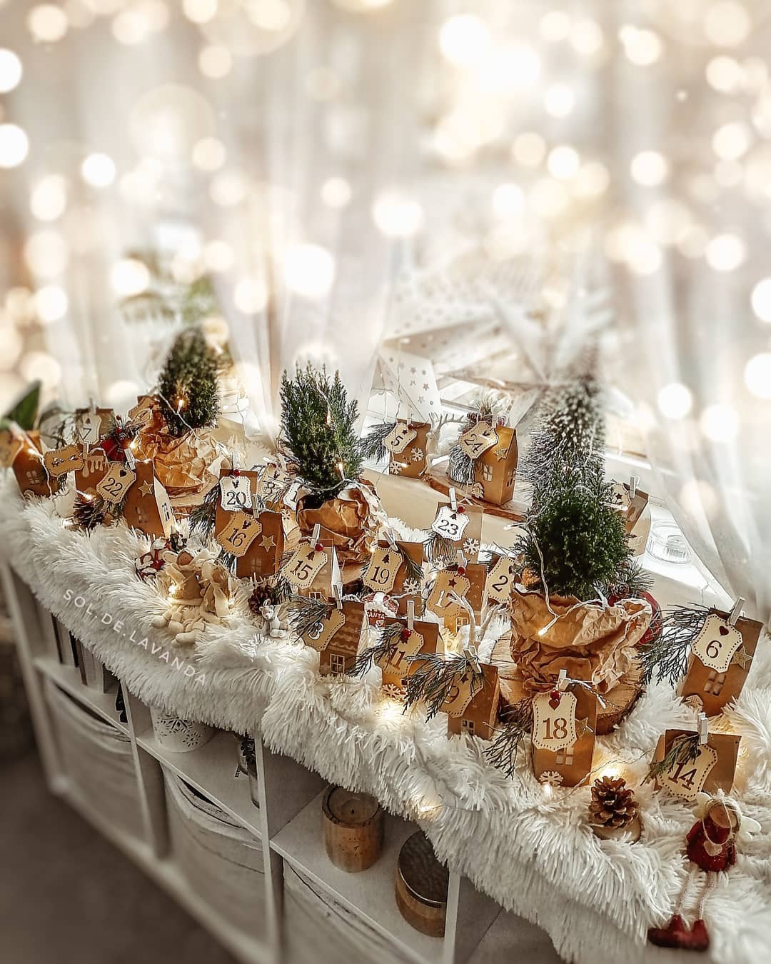 Magical Scandinavian Christmas vignette with advent calendar and fairy lights - @sol.de.lavanda