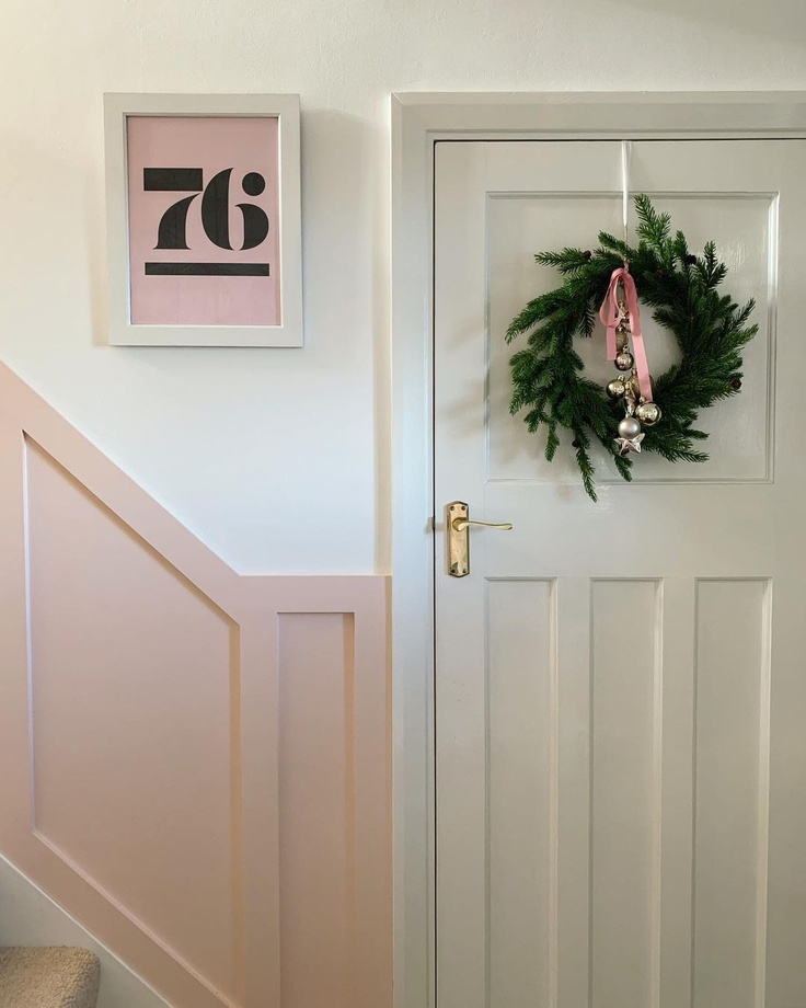 Valspar Bare Necessity paint color on paneled wall in a home by @thevintagehousethatcould.