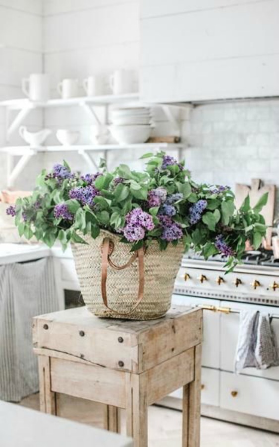 White Country french farmhouse decor inspiration in a kitchen with Lacanche range, white marble, and copper pots. #dreamywhites #fernchcountrykitchen #frenchkitchen #frenchfarmhouse #interiordesign #kitchendesign