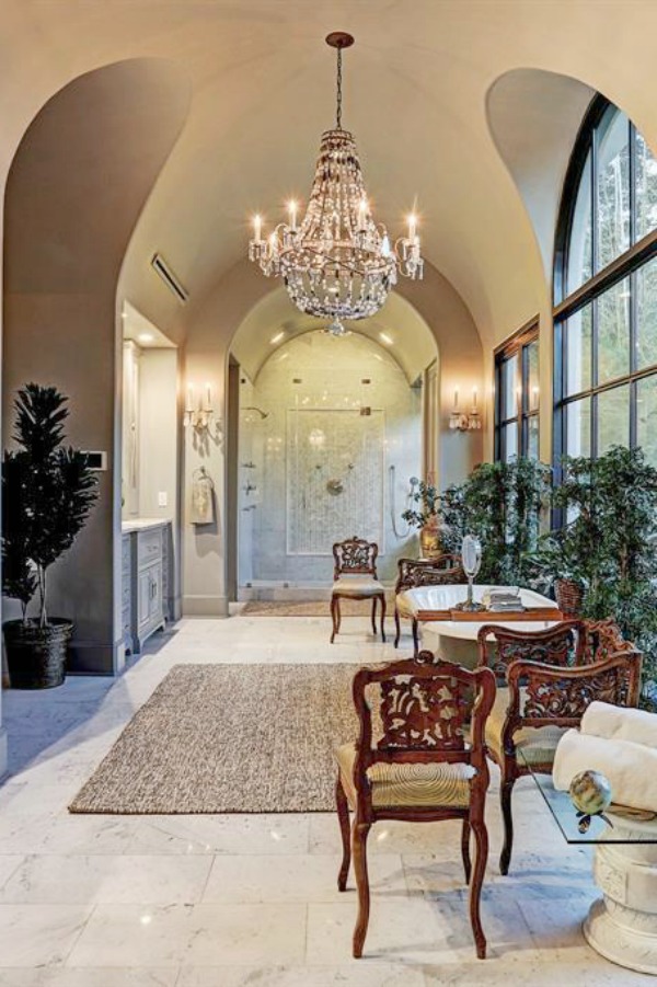 Architecturally magnificent and luxurious French country bathroom in a sophisticated Houston mansion by TOH. #luxuriousbathroom #frenchcountry #customhomedesign