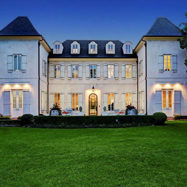 Magnificent French country exterior of a Houston mansion by Thomas O'Neill Homes. #frenchcountry #houseexterior #luxuryhome #homedesign