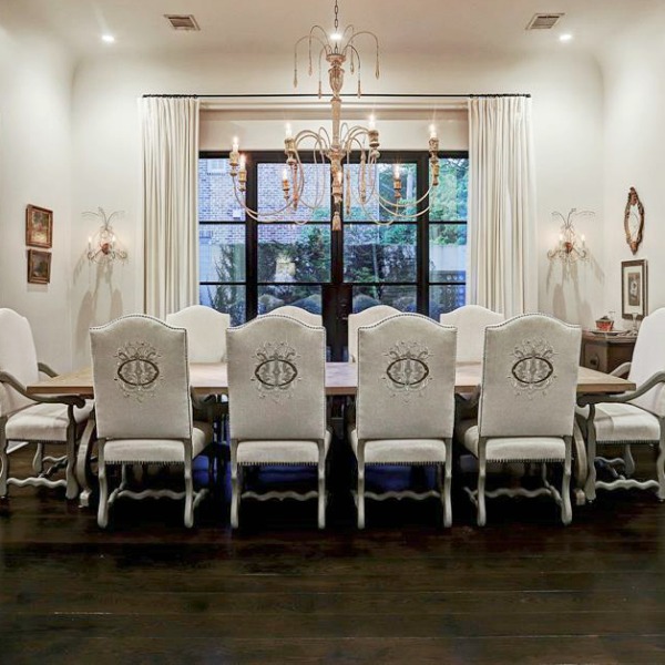 Elegant French country white dining room in a Houston mansion by Thomas O'Neill Homes. #frenchcountry #diningroom #luxuryhome #interiordesign