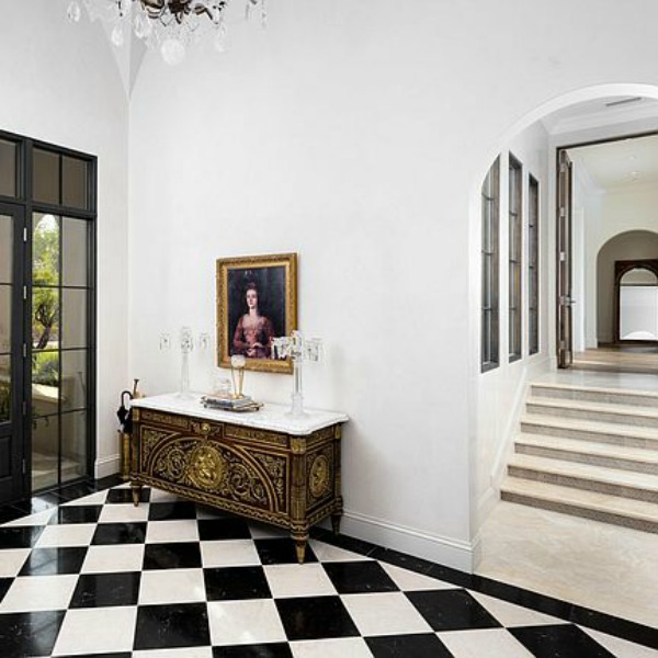 Elegant black and white formal entry in a classic and luxurious French country inspired Scottsdale home. #entry #elegantdecor #luxurioushome #blackandwhitefloor