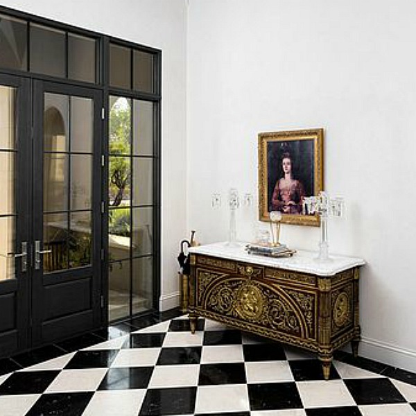 Elegant black and white formal entry in a classic and luxurious French country inspired Scottsdale home. #entry #elegantdecor #luxurioushome #blackandwhitefloor