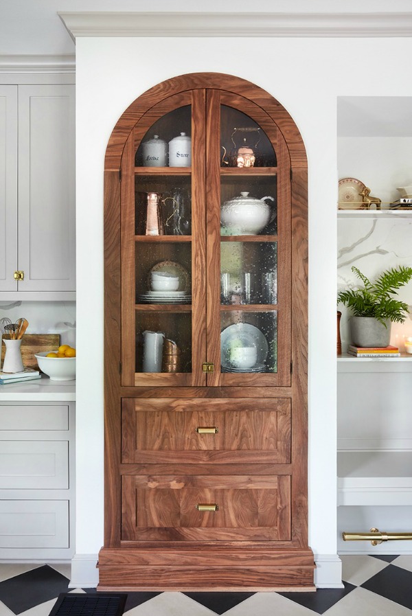Beautiful kitchen built-in! This tranquil Tudor cottage was renovated on HGTV's Fixer Upper by Chip and Joanna and is known as the Scrivano House. #fixerupper #scrivano #cottagestyle #interiordesign #greytrim #serenedecor