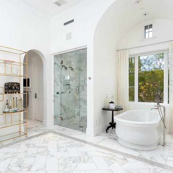 Luxurious white marble French country bathroom in a stunning Scottsdale home. #luxuriousbathroom #whitemarble #bathroomdesign