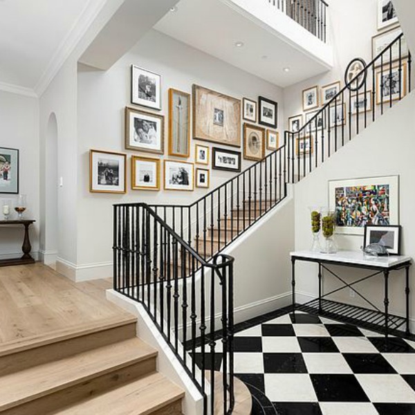 Elegant black and white formal entry and staircase in a classic and luxurious French country inspired Scottsdale home. #entry #elegantdecor #luxurioushome #blackandwhitefloor