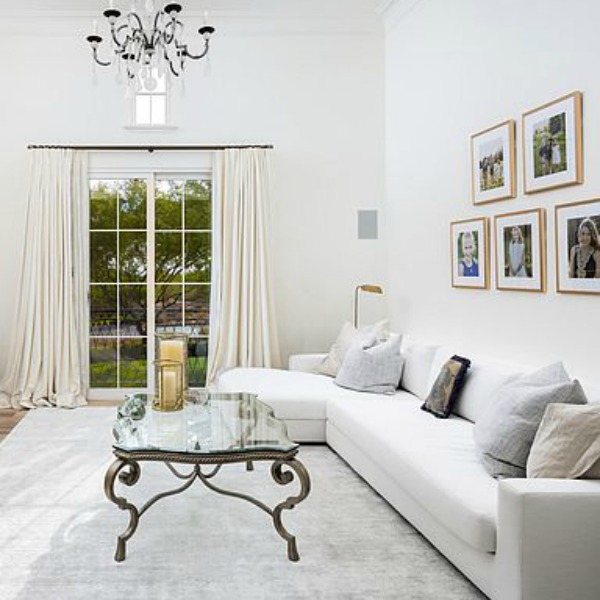 White sofa with chaise in a luxurious French bedroom in Scottsdale.