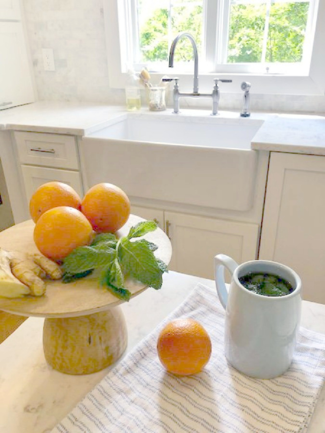 Ingredients for fresh mint tea in my white kitchen - Hello Lovely Studio. Easy Healthy Food Swaps to Make as well as ideas for Smart Tweaks in the New Year.