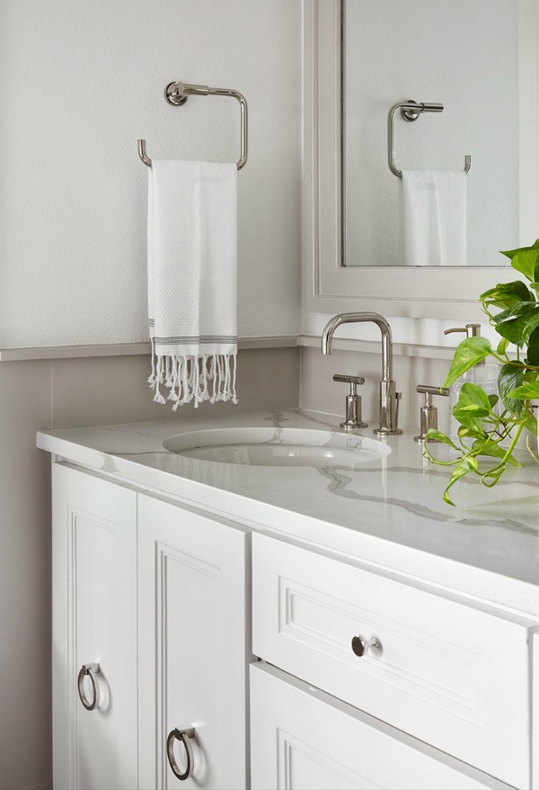 This tranquil Tudor cottage was renovated on HGTV's Fixer Upper by Chip and Joanna and is known as the Scrivano House. #fixerupper #scrivano #cottagestyle #interiordesign #greytrim #serenedecor #bathroom