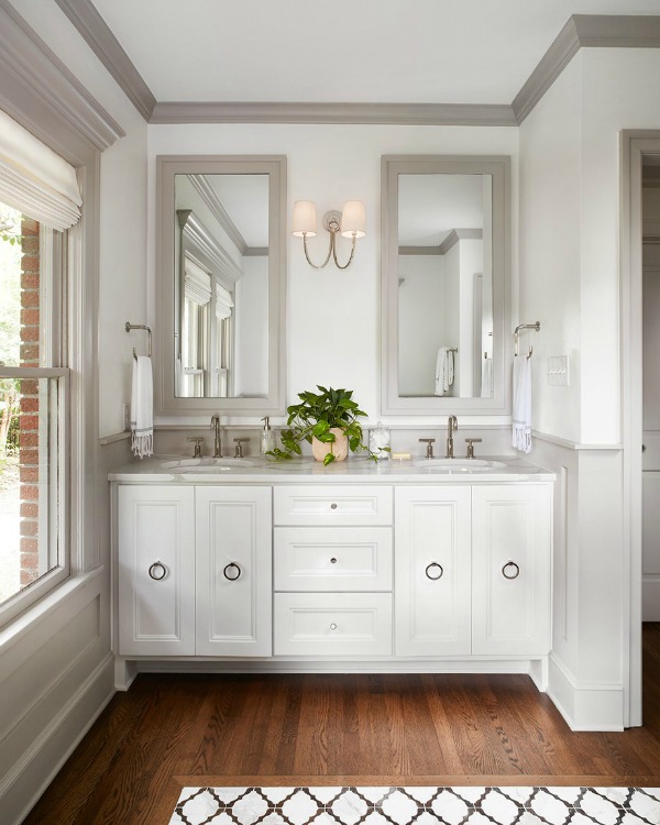 This tranquil Tudor cottage was renovated on HGTV's Fixer Upper by Chip and Joanna and is known as the Scrivano House. #fixerupper #scrivano #cottagestyle #interiordesign #greytrim #serenedecor #bathroomvanity