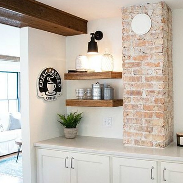 Urban farmhouse kitchen design with rustic beams, island, and metal stools. #hellolovelystudio #urbanfarmhouse #farmhousekitchen #modernfarmhousekitchen