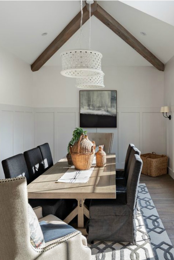 Dining room with vaulted ceiling and wood beams - interior design by Jaimee Rose Interiors.