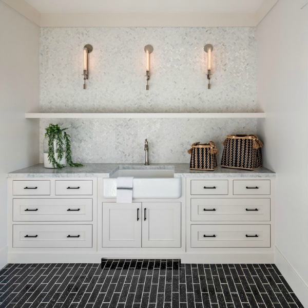 Classic white cabinetry and modern farmhouse style in a mud room with black tile - Jaimee Rose Interiors. #mudroom #modernfrmhouse