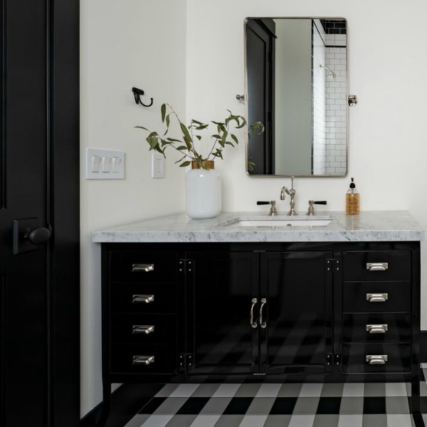 Modern farmhouse bathroom with black vanity, gingham tiled floor and black painted trim - Jaimee Rose Interiors.