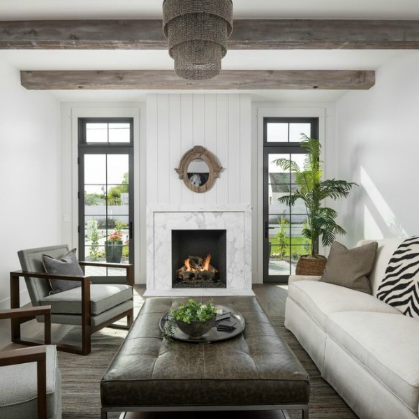 Beautiful living room with board and batten and modern farmhouse interior design by Jaimee Rose Interiors. #modernfarmhouse #interiordesign