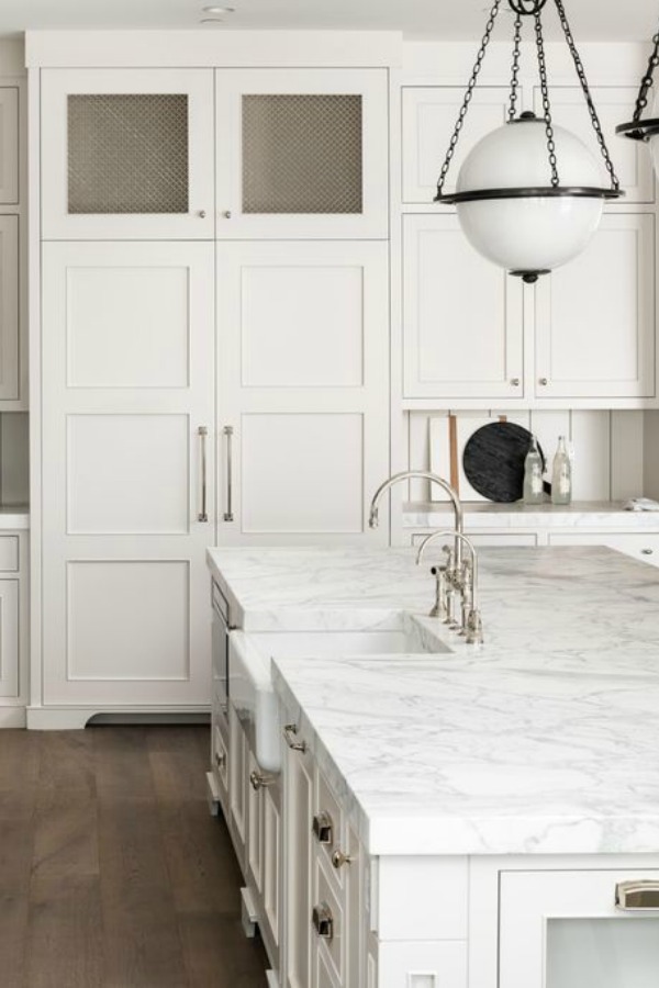 Classic white custom kitchen cabinets, midcentury modern globe pendants, and polished nickel hardware - Jaimee Rose Interiors.