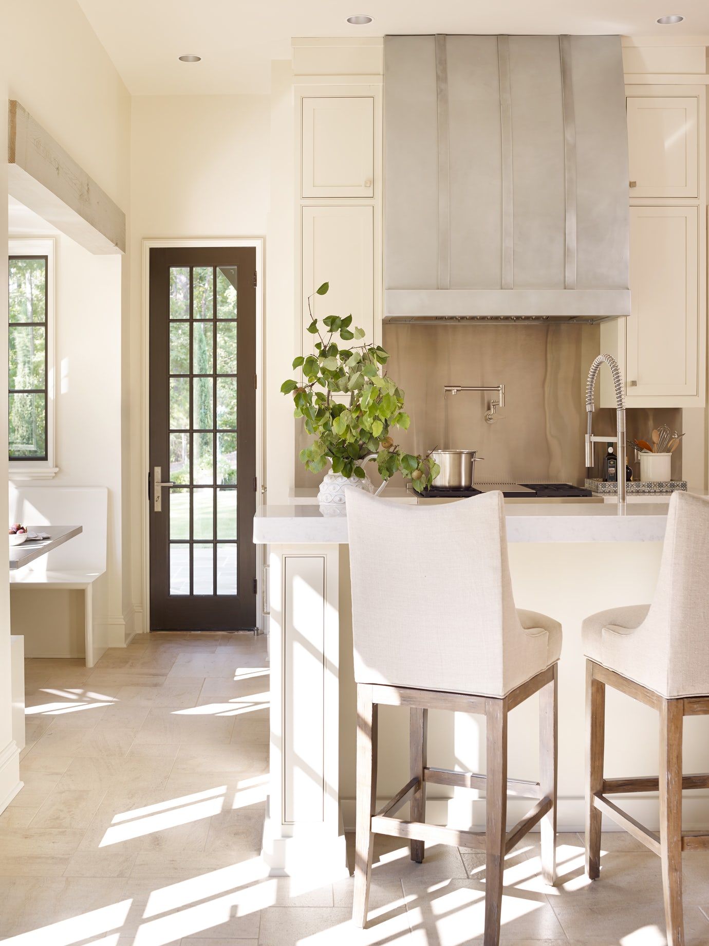 A gorgeous bespoke kitchen with pale tones and lovely texture - Jeffrey Dungan.