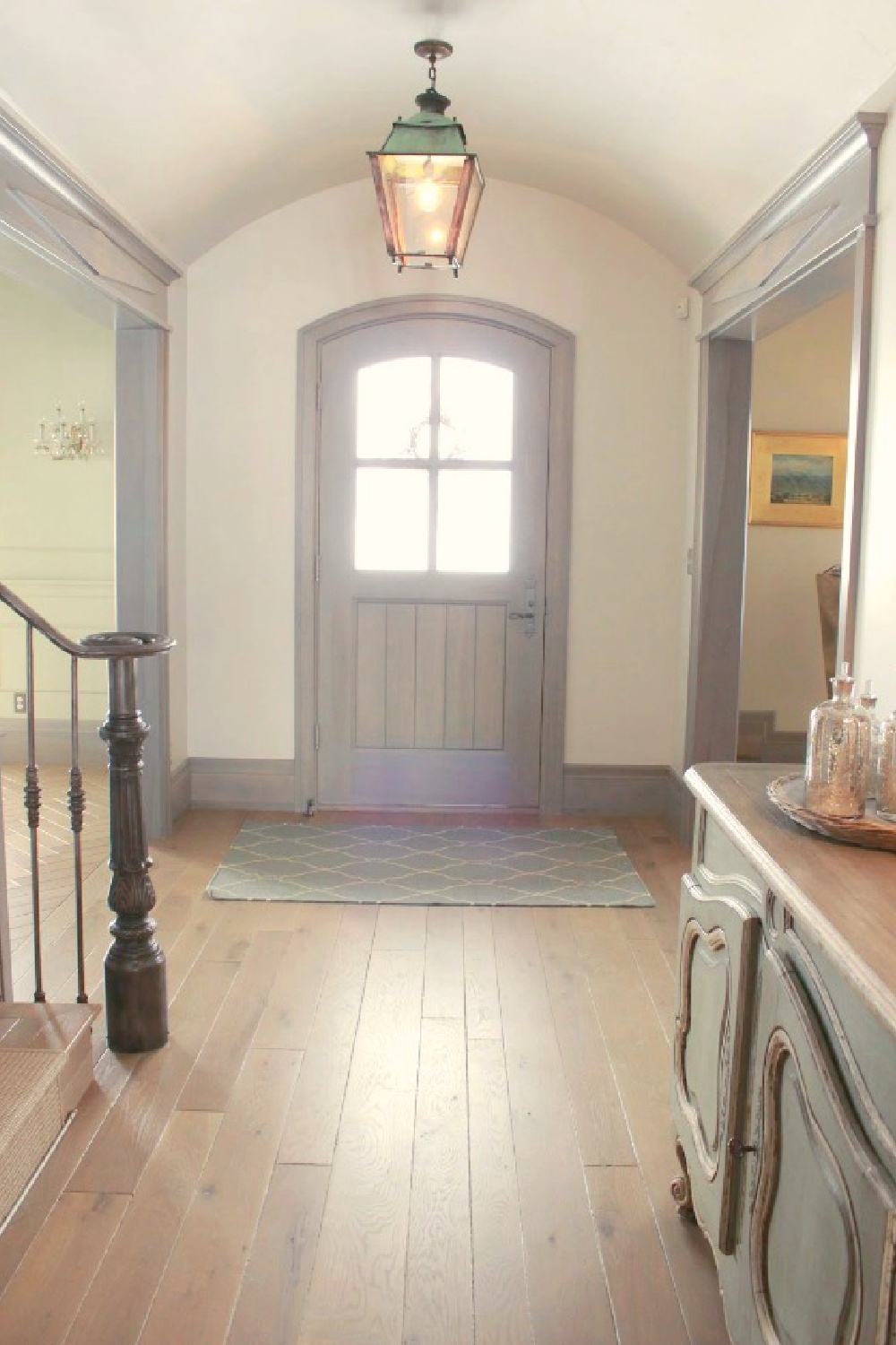 Arched front door and entry in rustically elegant European country cottage - Desiree of Beljar Home and DecordeProvence. #europeancountry #cottagestyleinteriors