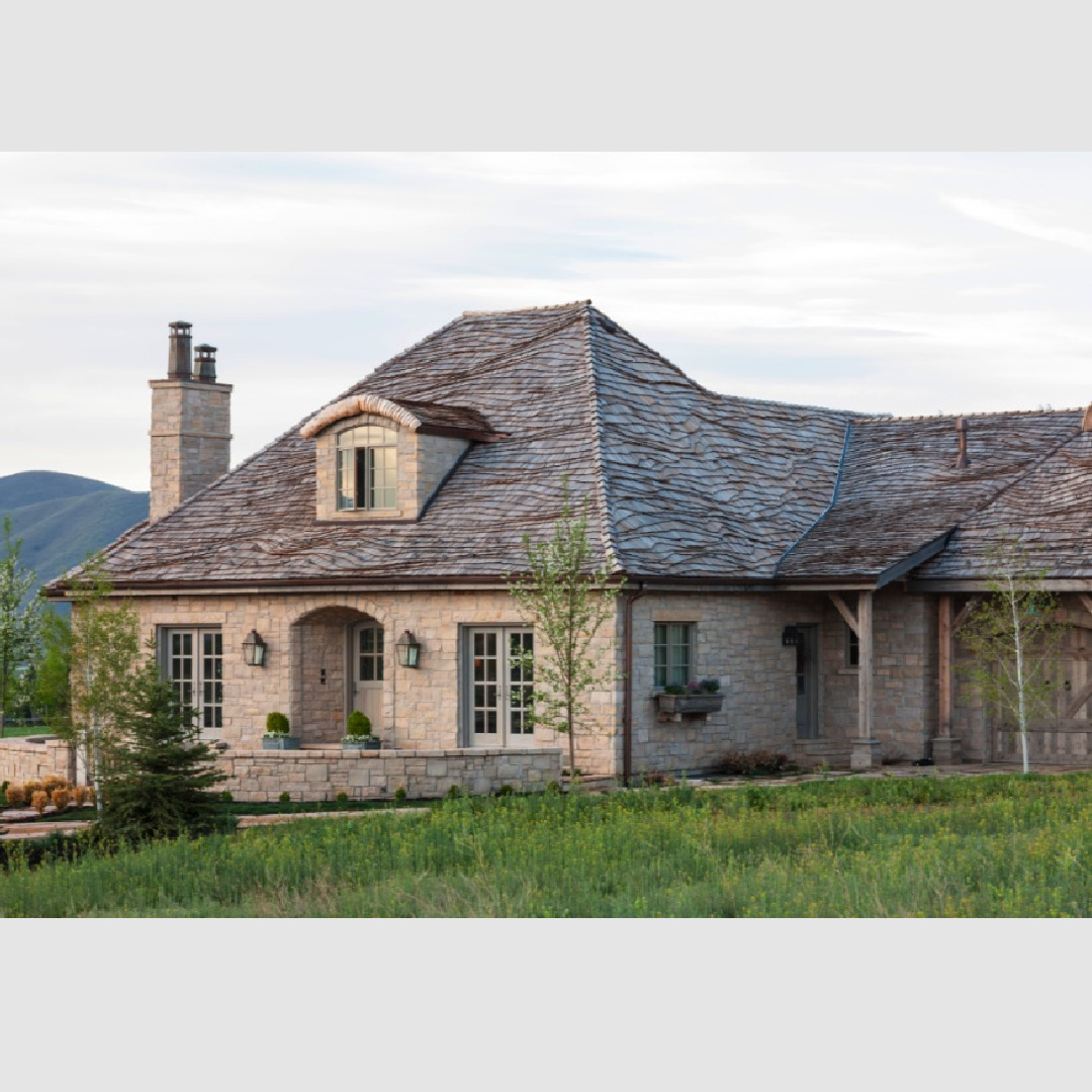 Exterior of a lovely Gustavian French home in Utah with stone, eyebrow details, and distinctive roof. DecordeProvence and Beljar Home. #frenchgustavian #europeancountrycottage