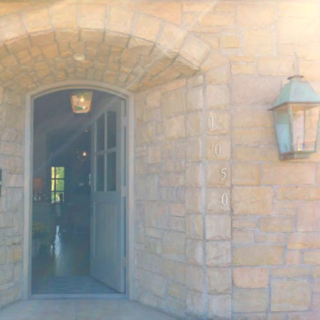 Beautiful warm stone entry with arch in rustically elegant European country cottage - Desiree of Beljar Home and DecordeProvence. #europeancountry #cottagestyleinteriors