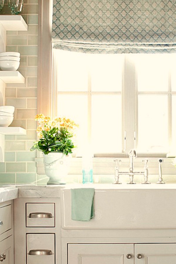 Serene white and bright French kitchen with farm sink and light green subway tile backsplash - come tour French Fantasy House Build: A Timeless Tranquil Home Favorite!