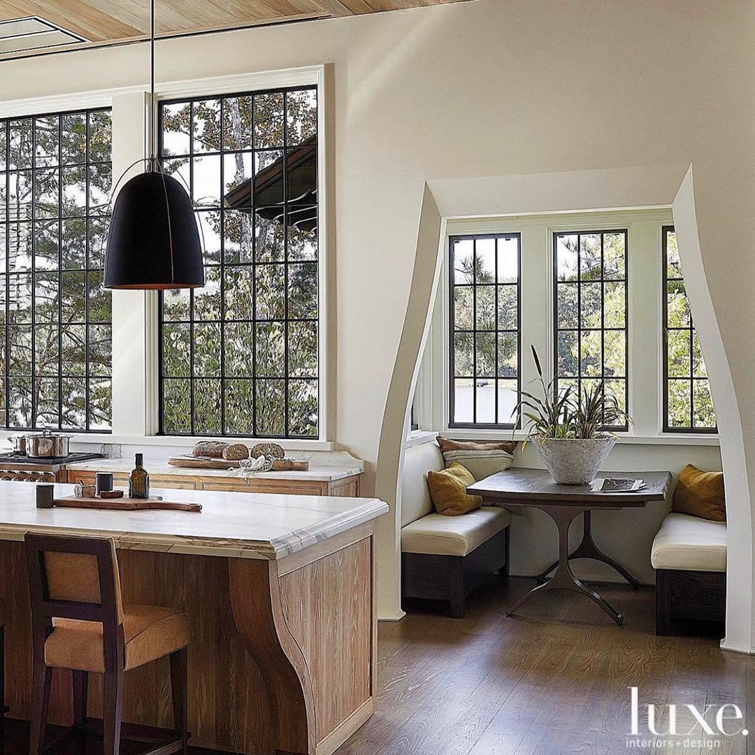 Jeffrey Dungan designed kitchen with amazing architecture and built-in breakfast nook - Luxe Magazine.