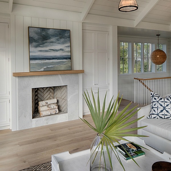 Coastal cottage fireplace in great room of a Palmetto Bluffs lake house by Lisa Furey. #fireplace #coastalcottage #interiordesign