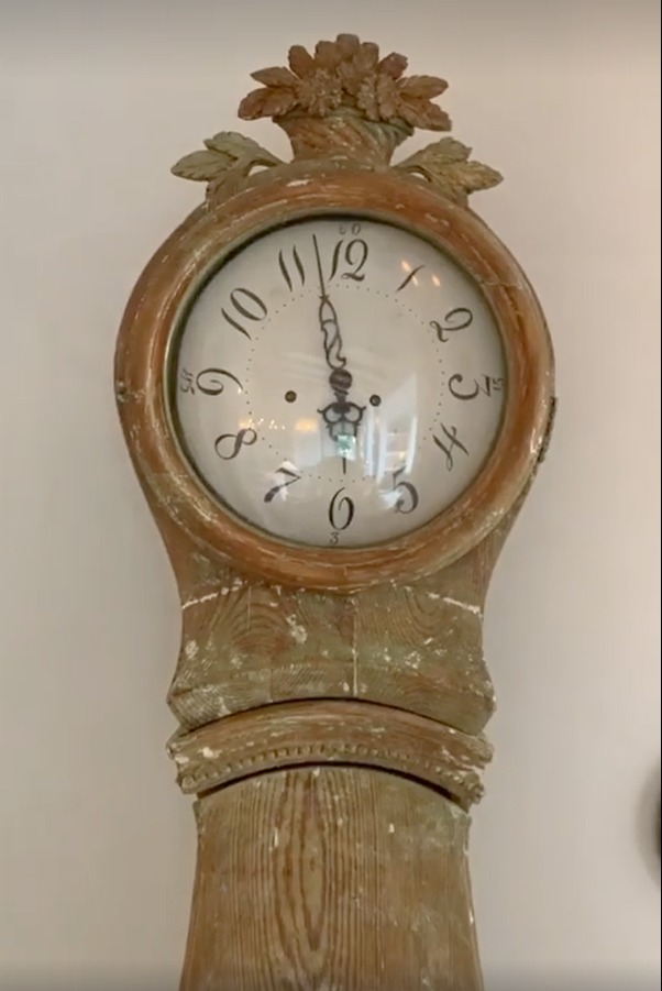 Swedish mora clock in romantic bedroom at Patina Farm (a European country farmhouse by Giannetti Home) with Old World style, sumptuous linens, a French stone fireplace, and rustic elegant charm. #moraclock #interiordesign #swedishantiques #europeancountry #frenchfarmhouse #patinafarm #brookegiannetti