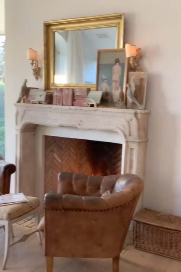 Romantic bedroom at Patina Farm (a European country farmhouse by Giannetti Home) has antiques from Sweden, sumptuous linens, a French stone fireplace, and rustic elegant charm. #interiordesign #bedroomdesign #europeancountry #frenchfarmhouse #patinafarm #brookegiannetti