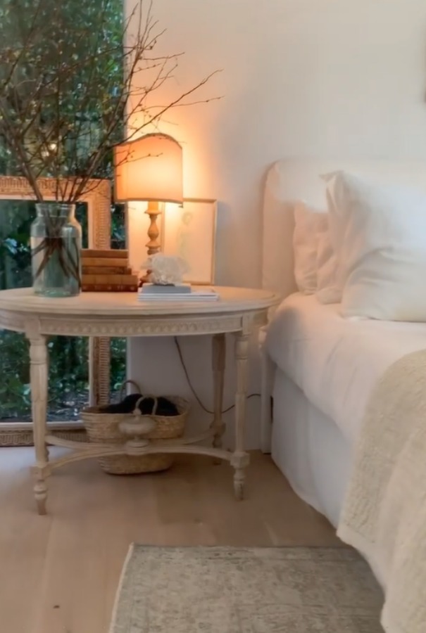 Romantic bedroom at Patina Farm (a European country farmhouse by Giannetti Home) has antiques from Sweden, sumptuous linens, a French stone fireplace, and rustic elegant charm. #interiordesign #bedroomdesign #europeancountry #frenchfarmhouse #patinafarm #brookegiannetti